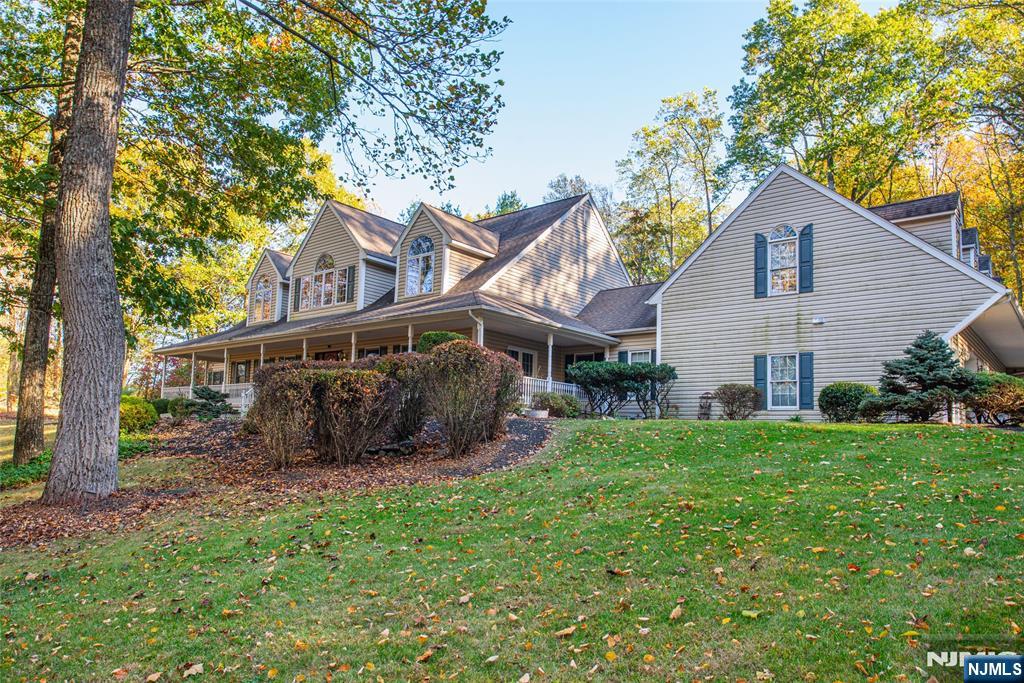 190 Andover Mohawk Road Andover, NJ 07821 - Photo 2 of 45 a house that has a tree in front of it