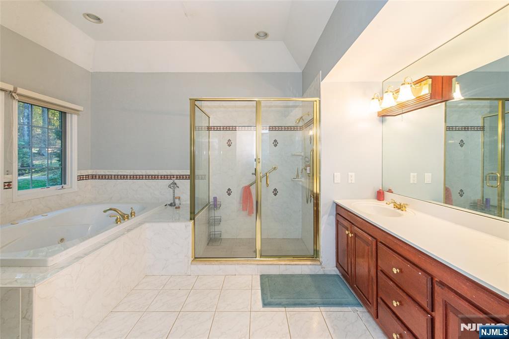 190 Andover Mohawk Road Andover, NJ 07821 - Photo 21 of 45 a spacious bathroom with a tub sink shower and mirror