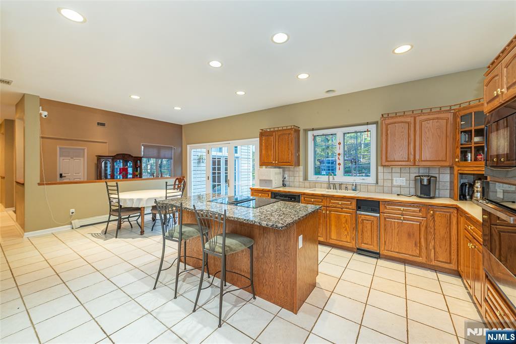 190 Andover Mohawk Road Andover, NJ 07821 - Photo 26 of 45 a kitchen with stainless steel appliances granite countertop a refrigerator and a stove top oven