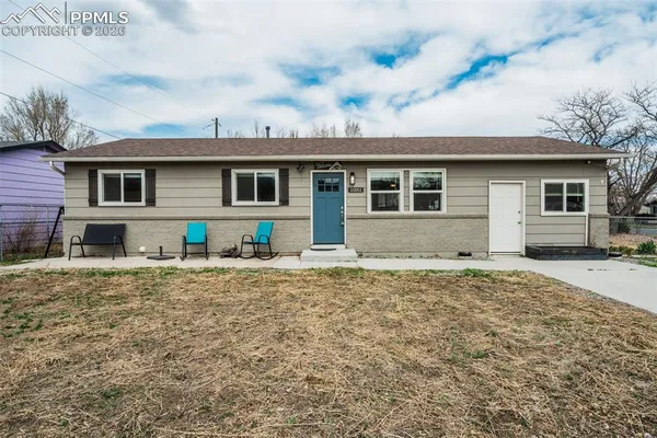 a house with yard in front of it