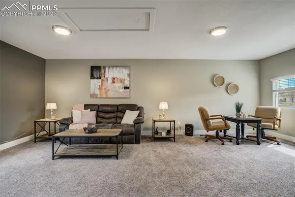 a living room with furniture and a table