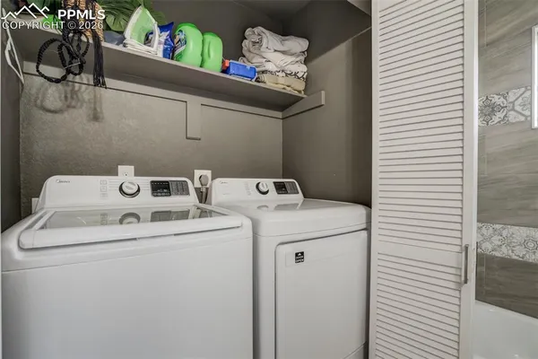 a utility room with dryer and washer