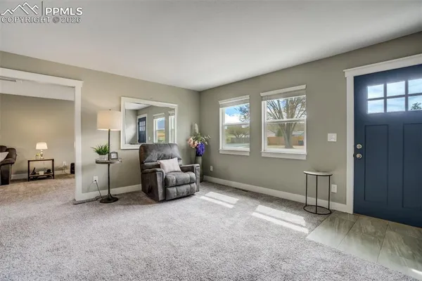 a living room with furniture and a window