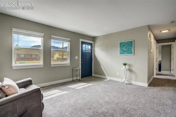 a living room with furniture and window