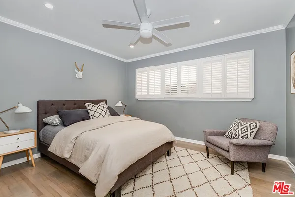 a bedroom with a bed and a couch