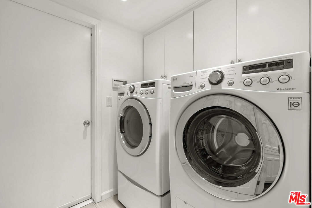 2761 Hutton Drive Beverly Hills, CA 90210 - Photo 14 of 29 a utility room with dryer and washer