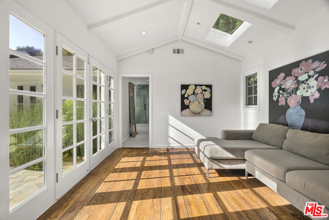 2761 Hutton Drive Beverly Hills, CA 90210 - Photo 19 of 29 a living room with furniture and a rug