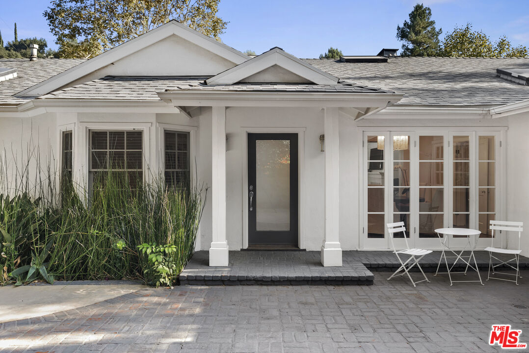 2761 Hutton Drive Beverly Hills, CA 90210 - Photo 2 of 29 a front view of a house with chairs