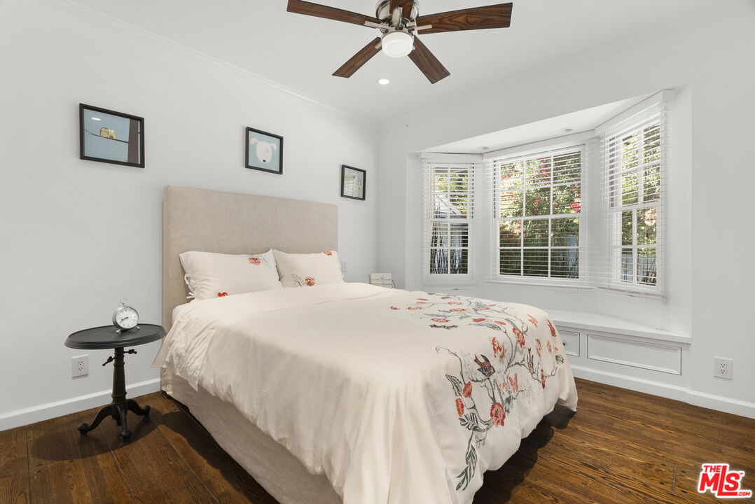 2761 Hutton Drive Beverly Hills, CA 90210 - Photo 24 of 29 a bedroom with a bed and a window