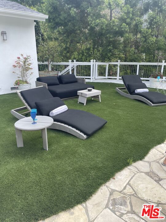 2761 Hutton Drive Beverly Hills, CA 90210 - Photo 27 of 29 a patio with table and chairs