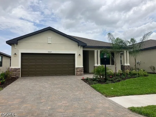 a front view of house with yard and green space