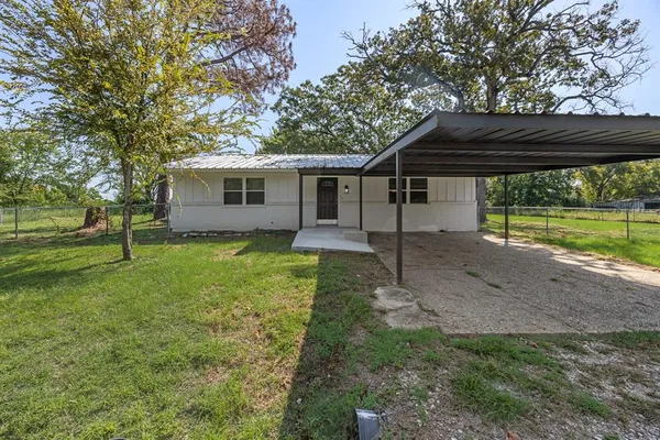 a view of a backyard of the house