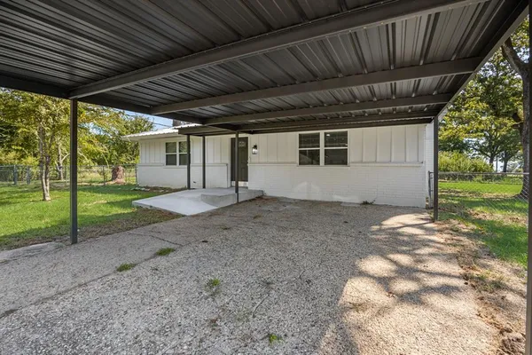 a view of a back yard of the house