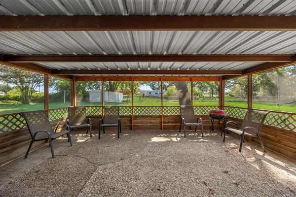 a view of a park with large trees