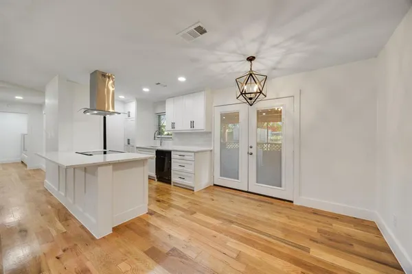 a kitchen with a sink stove and refrigerator