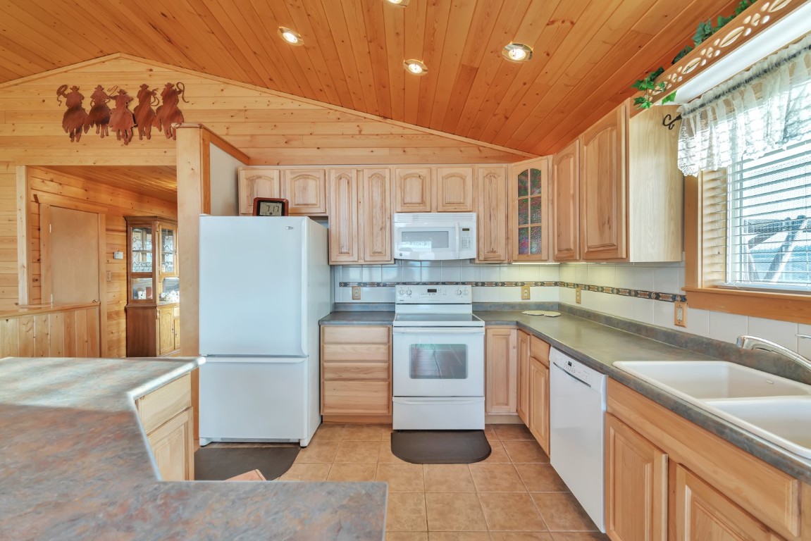 64 Flint Circle Como, CO 80456 - Photo 12 of 35 a kitchen with a sink appliances and cabinets