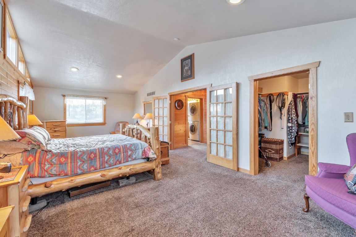 64 Flint Circle Como, CO 80456 - Photo 14 of 35 a bed room with a bed and a chair