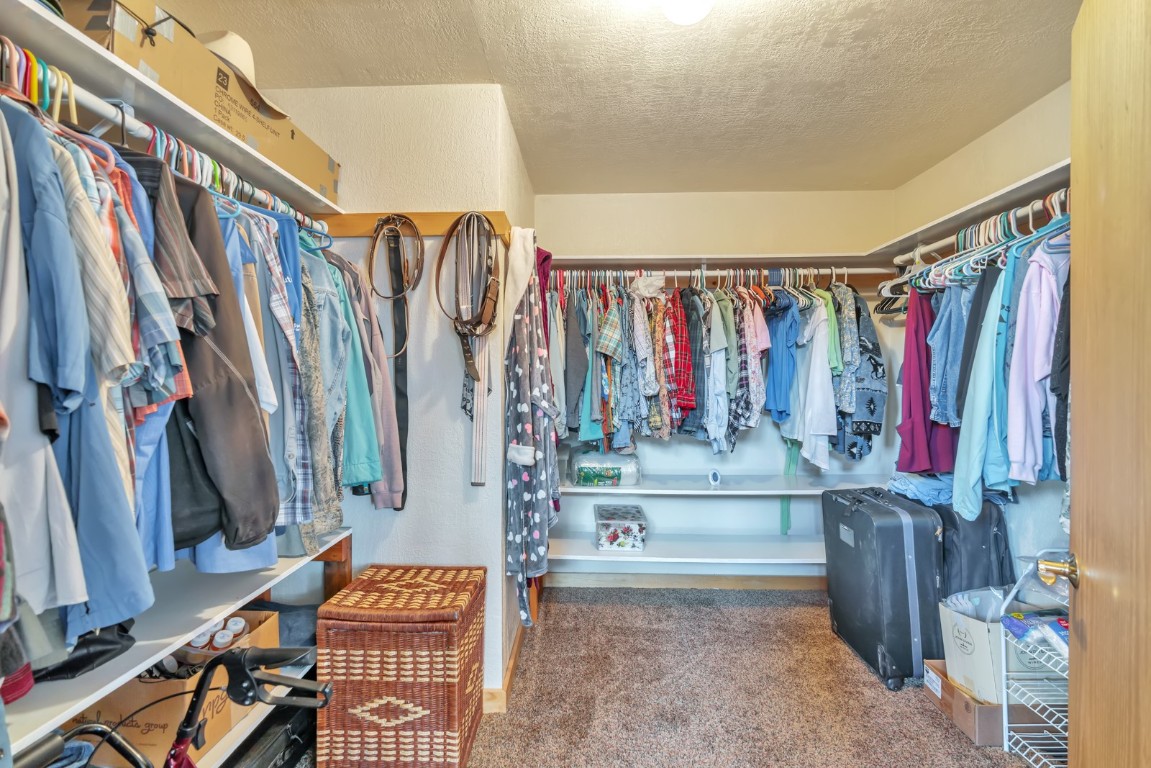 64 Flint Circle Como, CO 80456 - Photo 17 of 35 a view of walk in closet with clothes and shoes