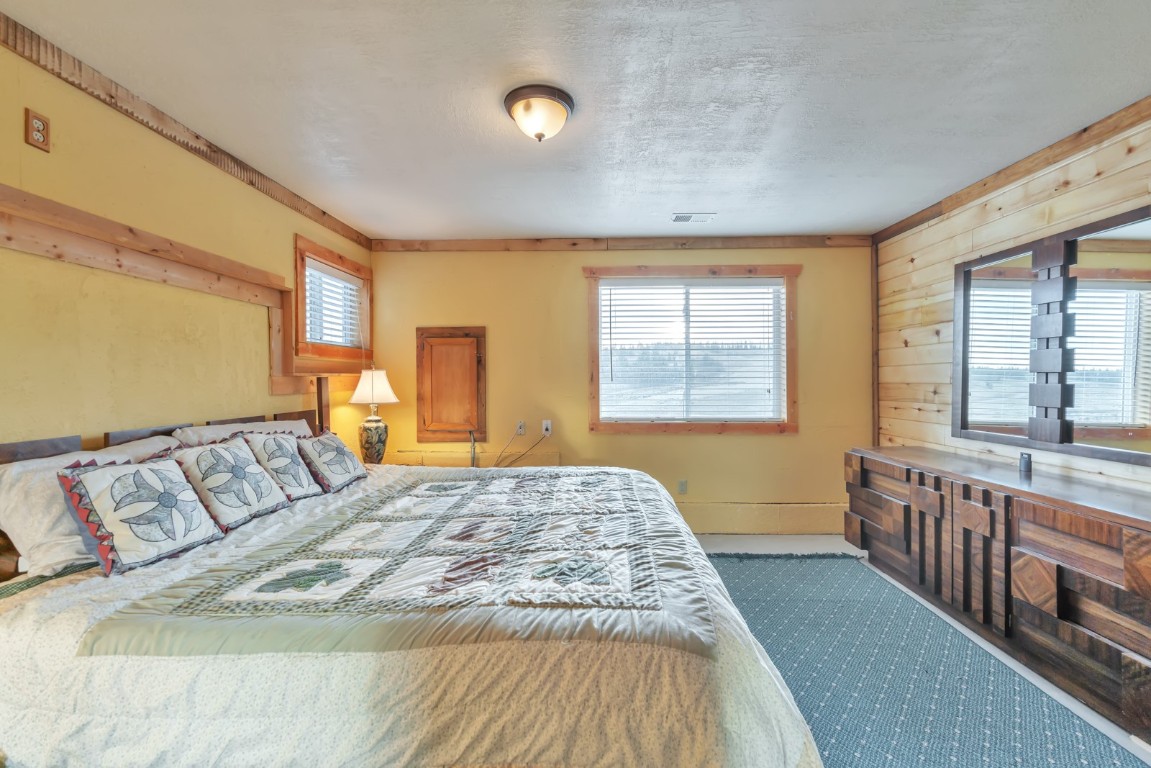 64 Flint Circle Como, CO 80456 - Photo 24 of 35 a bed sitting in a bedroom next to a window