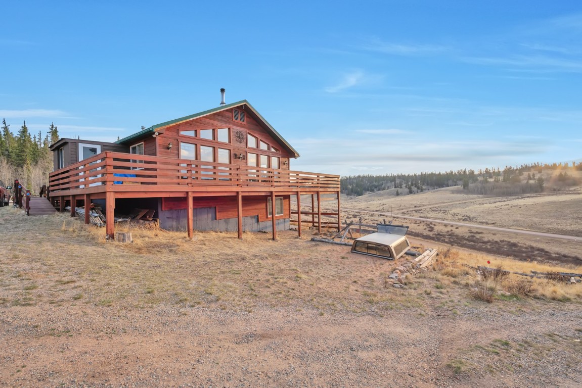 64 Flint Circle Como, CO 80456 - Photo 29 of 35 a view of a house with a yard and sitting area