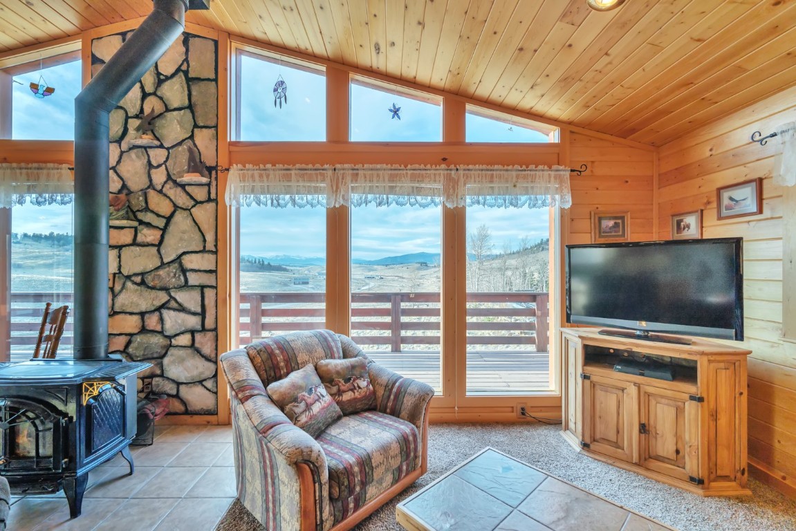 64 Flint Circle Como, CO 80456 - Photo 7 of 35 a outdoor living space with furniture and a flat screen tv