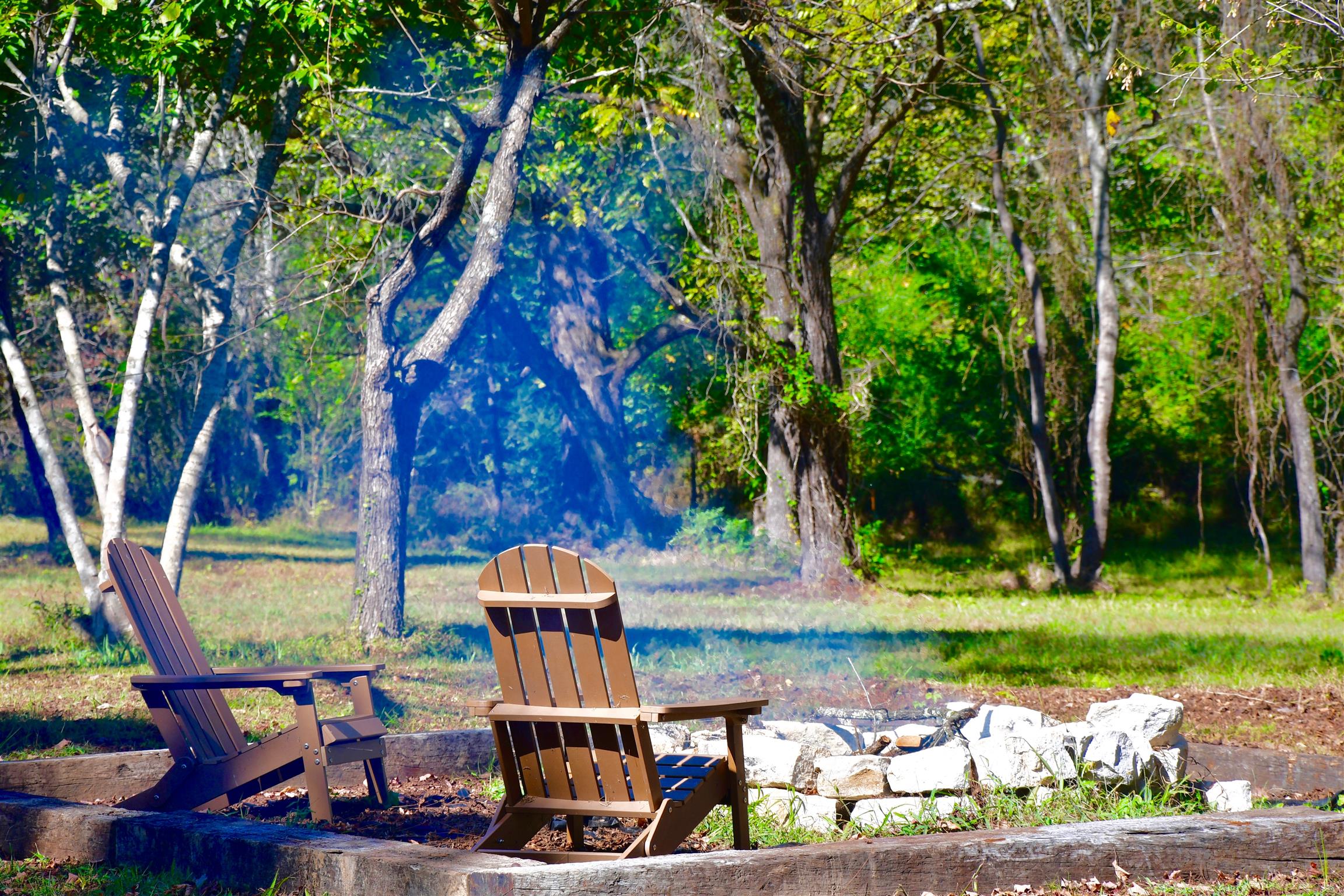 7803 Tatum Road Lyles, TN 37098 - Photo 3 of 18 Privacy Abounds you in the Backyard - The Firepit has been built utilizing the stones from the fireplace that had to be removed to widen the original staircase and lessen the steep angle.