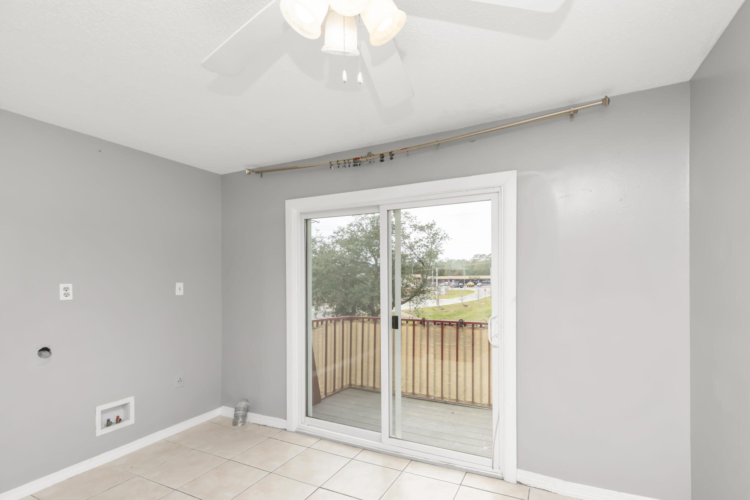 210 Pelham Road, Unit 219A Fort Walton Beach, FL 32547 - Photo 17 of 34 a view of a livingroom with a floor to ceiling window