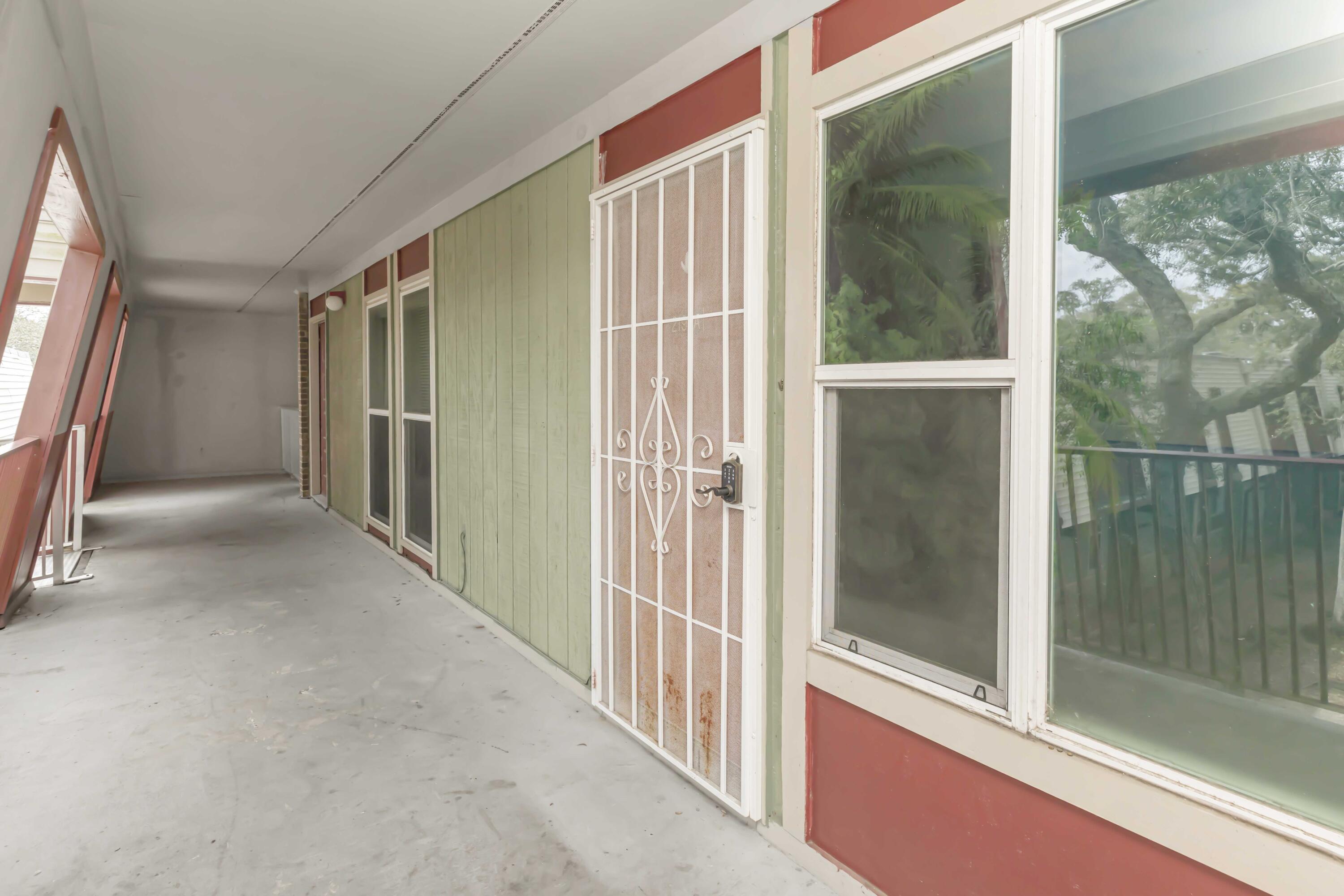 210 Pelham Road, Unit 219A Fort Walton Beach, FL 32547 - Photo 20 of 34 a view of a closet area with living room