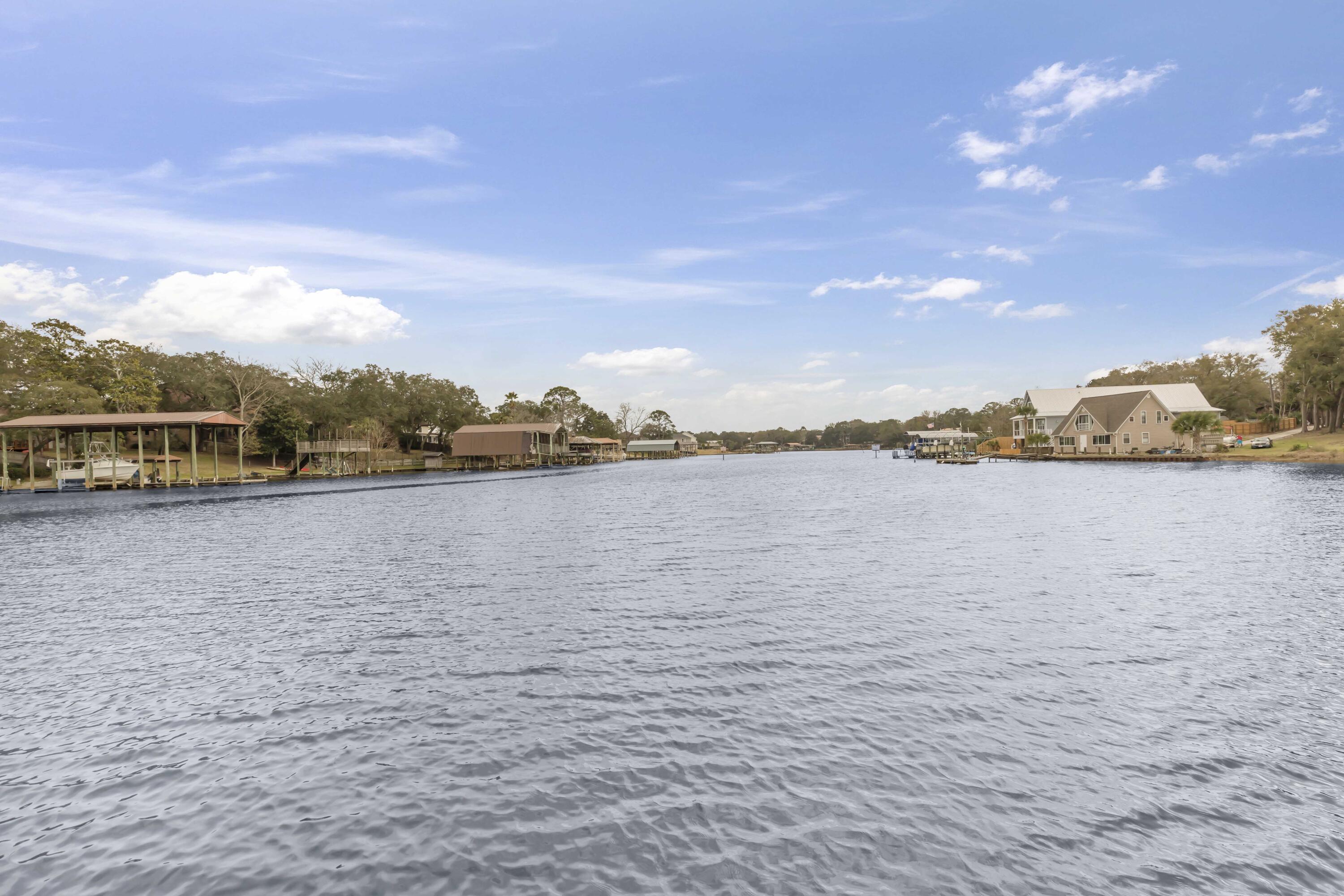 210 Pelham Road, Unit 219A Fort Walton Beach, FL 32547 - Photo 33 of 34 a view of outside space and a lake view