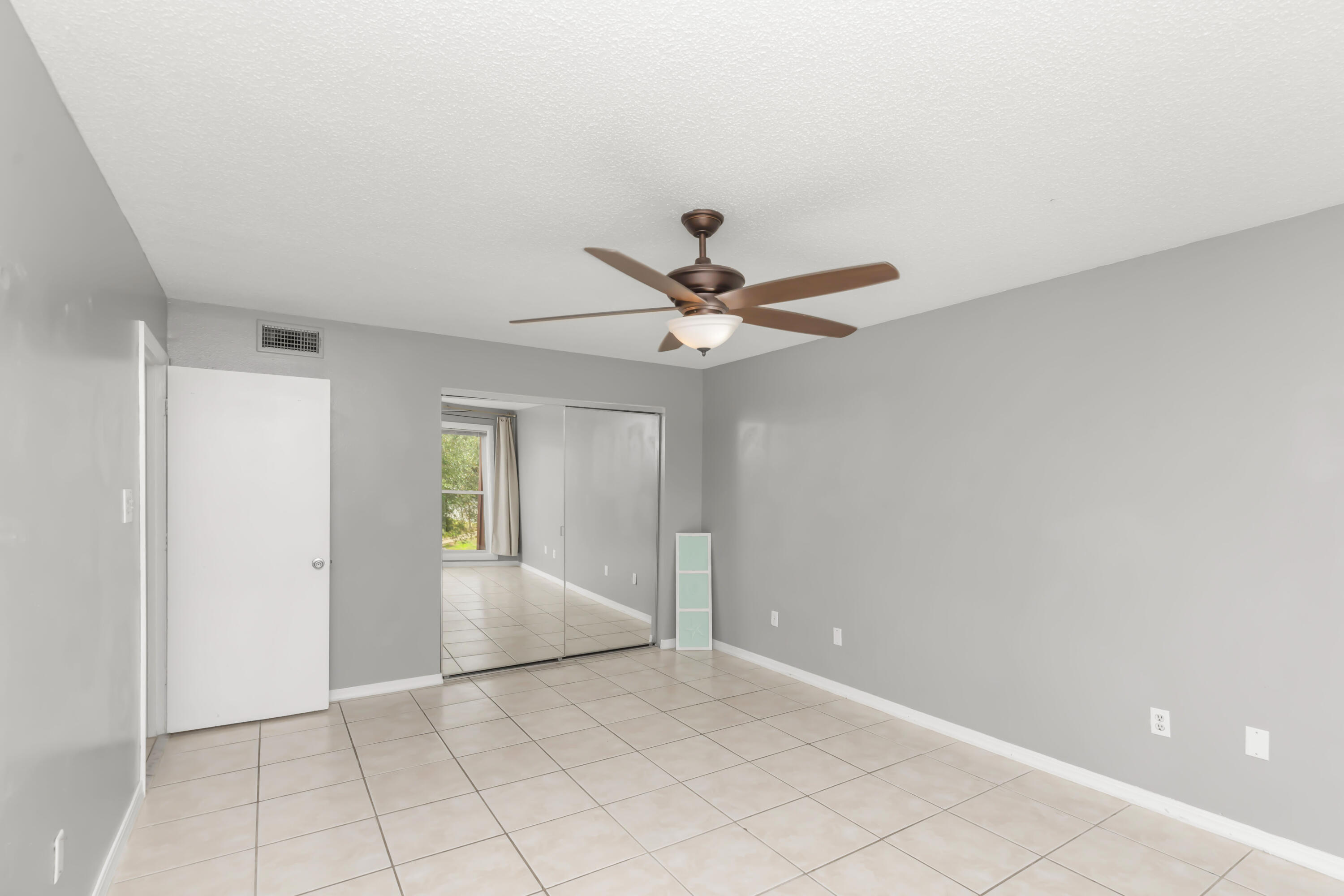 210 Pelham Road, Unit 219A Fort Walton Beach, FL 32547 - Photo 7 of 34 a view of an empty room and window