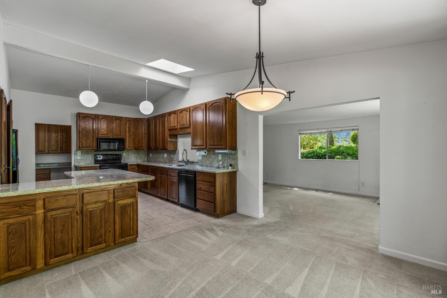 625-629 Hill Road Angwin, CA 94508 - Photo 10 of 64 a view of a kitchen with kitchen island a sink stainless steel appliances and cabinets