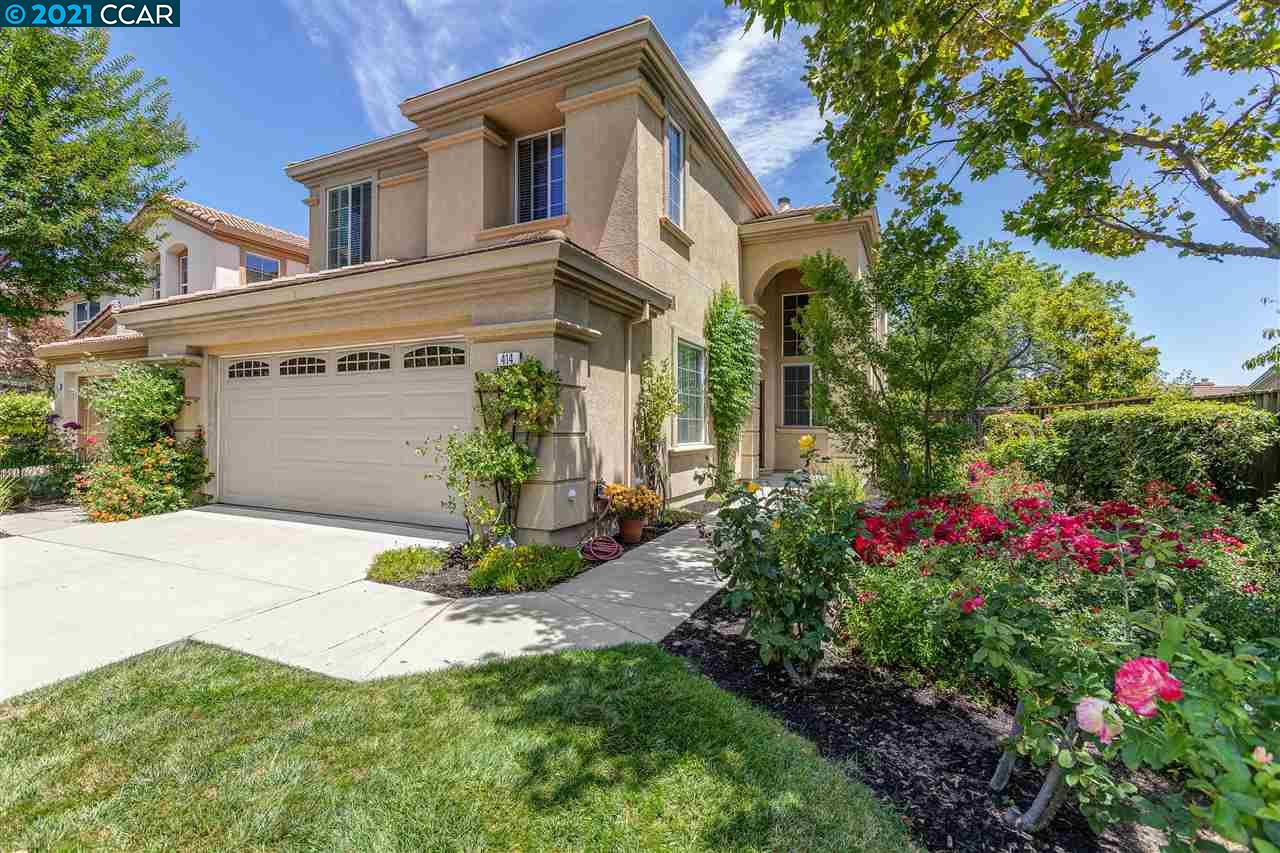 414 Fuchsia Lane San Ramon, CA 94582 - Photo 1 of 1 a front view of a house with a yard and garage