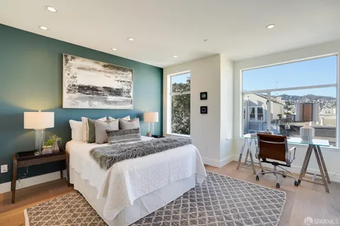 a bedroom with a bed and a lamp
