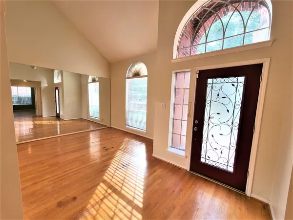 a view of a hallway with a large window