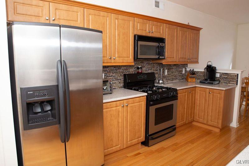 147 Pinehurst Lane Easton, PA 18042 - Photo 12 of 31 a kitchen with a refrigerator stove and microwave
