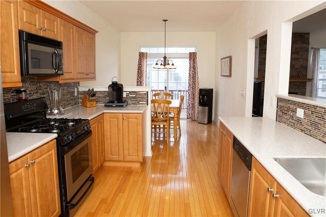 147 Pinehurst Lane Easton, PA 18042 - Photo 9 of 31 a kitchen with stainless steel appliances granite countertop a stove a sink and a microwave