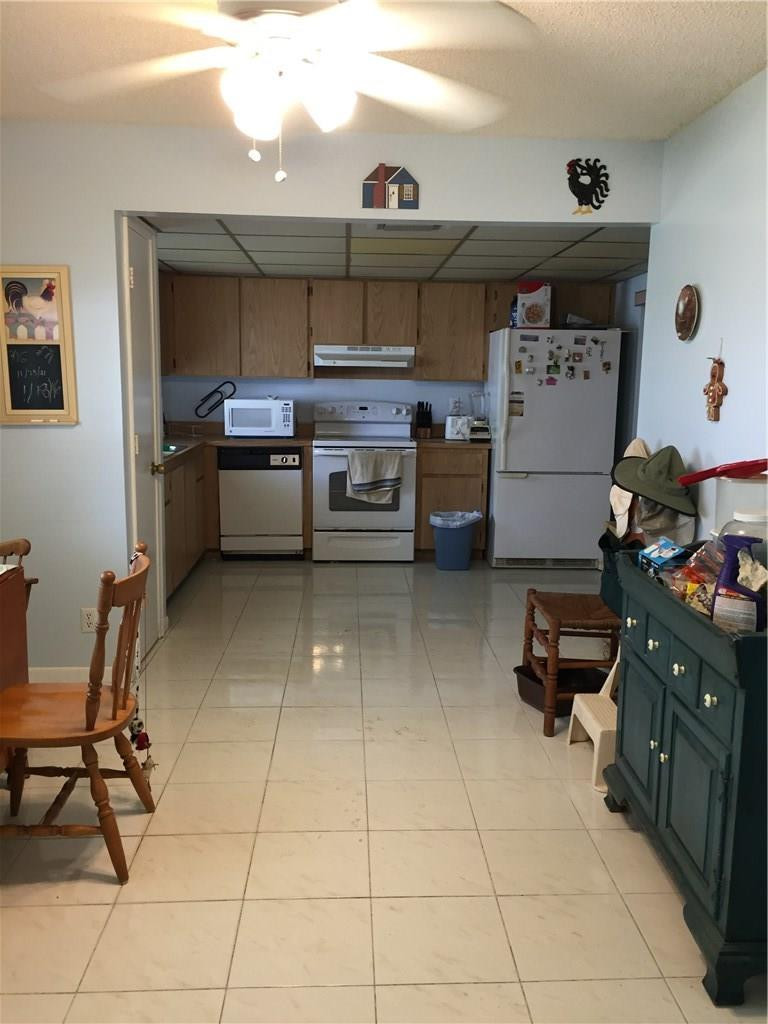 9369 Southwest 16th Street Boca Raton, FL 33428 - Photo 6 of 17 a kitchen with a sink and cabinets