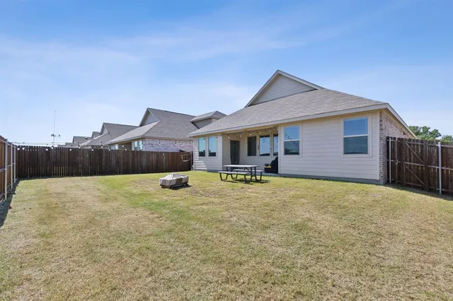 a view of a house with swimming pool and porch