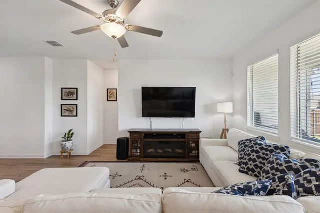 a living room with furniture or couch and a flat screen tv