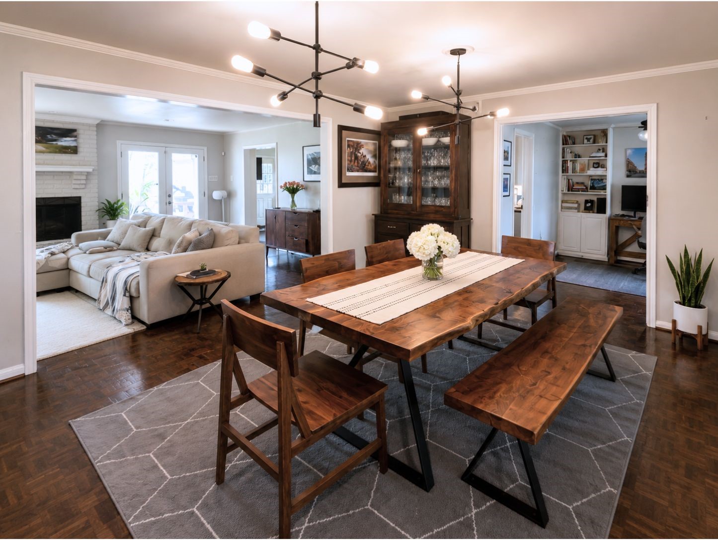13047 Taylorcrest Road Houston, TX 77079 - Photo 10 of 23 The formal dining room is ideal for hosting, offering an open layout that flows seamlessly into the living room while maintaining easy access to the adjacent home office.
