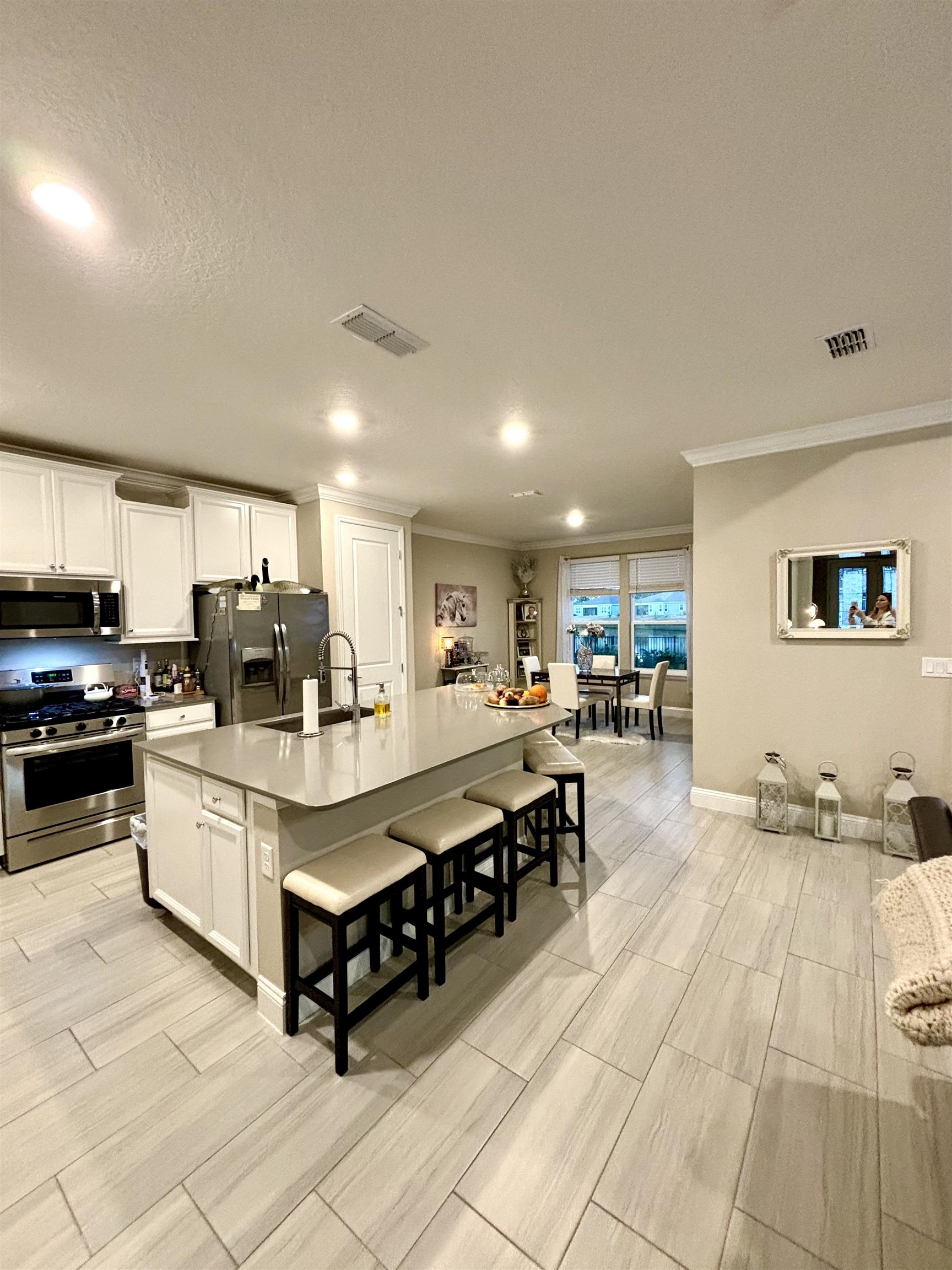 301 Silver Reef Lane St. Augustine, FL 32095 - Photo 13 of 43 a large white kitchen with stainless steel appliances a sink and cabinets