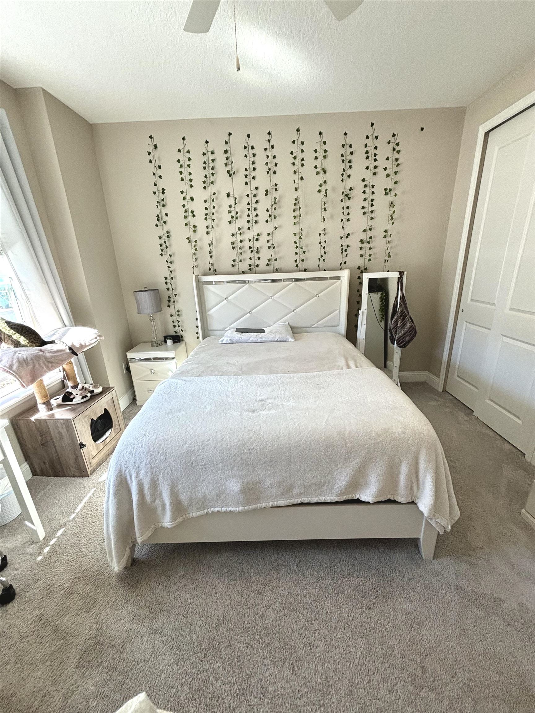 301 Silver Reef Lane St. Augustine, FL 32095 - Photo 19 of 43 a large bed sitting in a bedroom next to a window