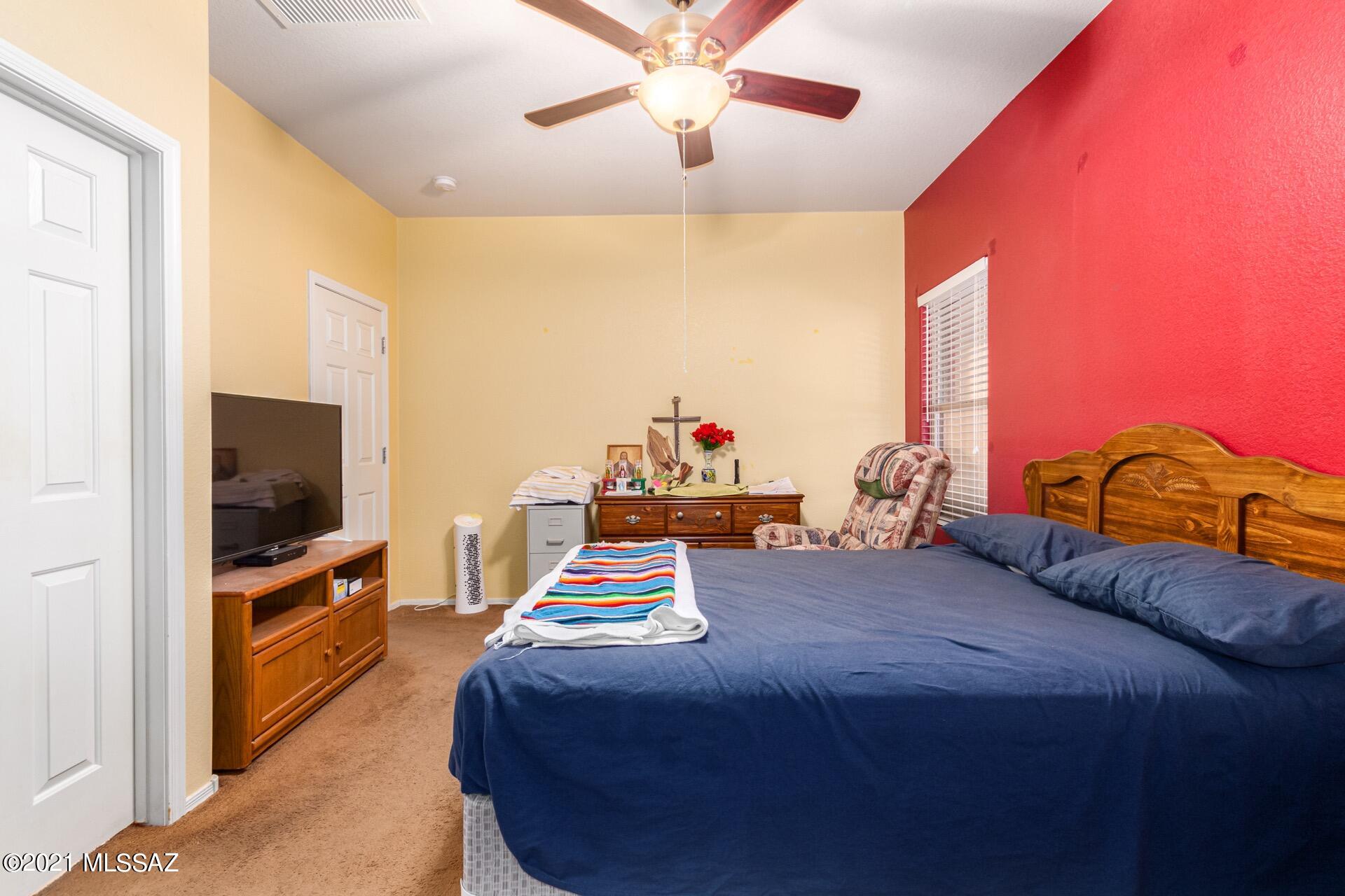 20894 East Founders Road Red Rock, AZ 85145 - Photo 15 of 27 a bedroom with a bed and a flat screen tv