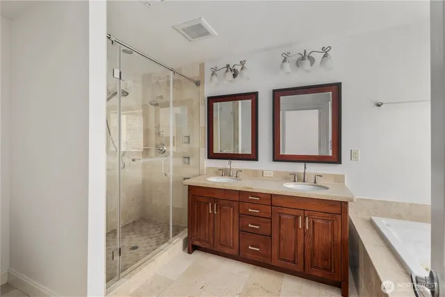 a bathroom with a double vanity sink mirror and double