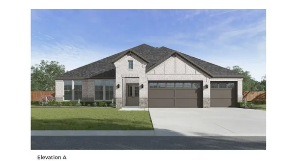 a front view of a house with a garden and yard