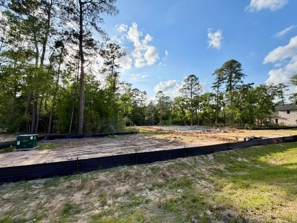 a view of a swimming pool with a yard