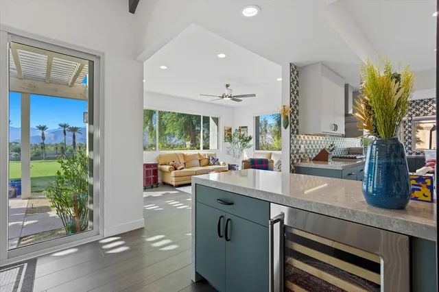 a kitchen with sink refrigerator and stove