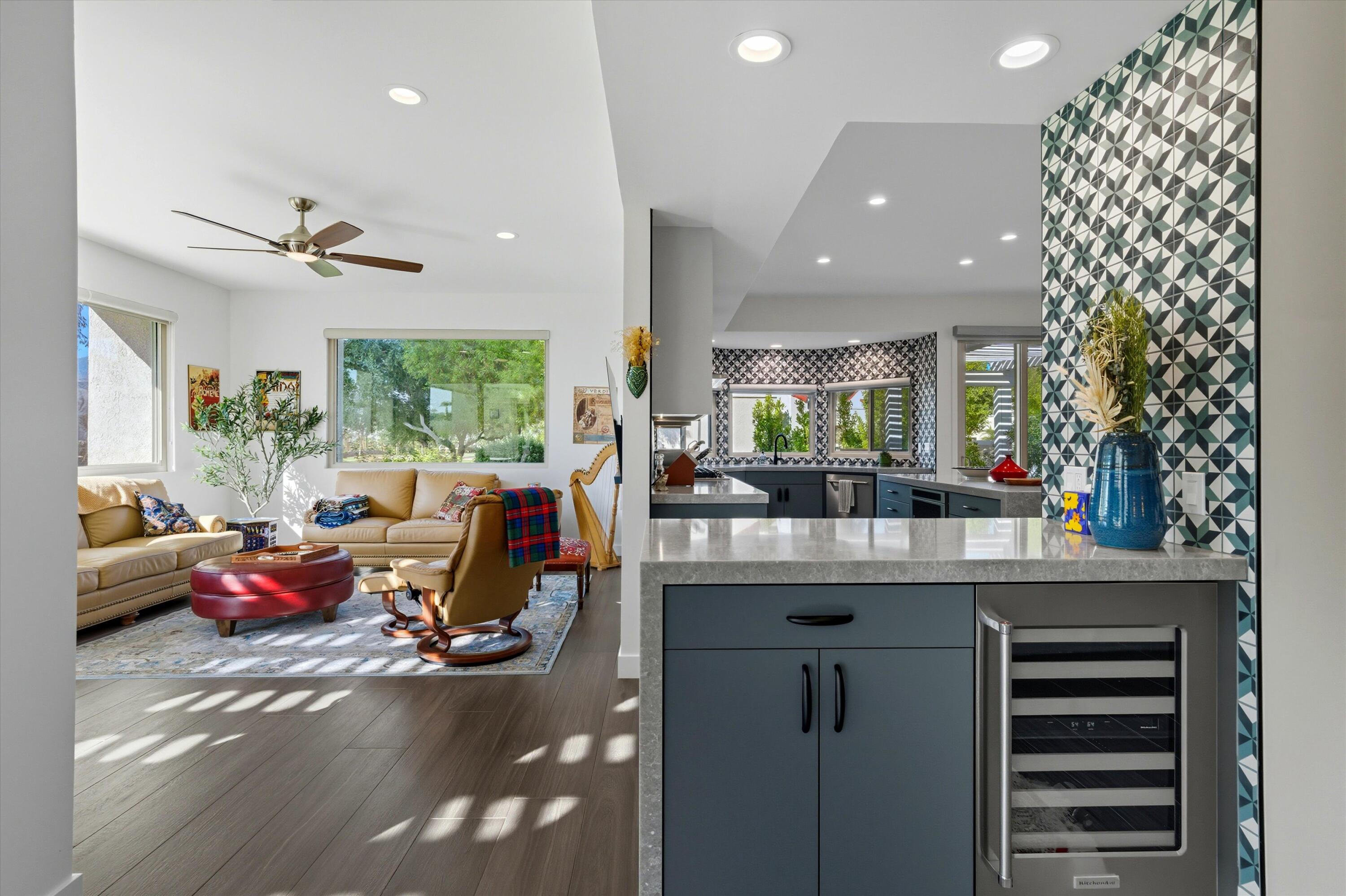 809 Inverness Drive Rancho Mirage, CA 92270 - Photo 18 of 36 a very nice looking room with kitchen island furniture and a chandelier