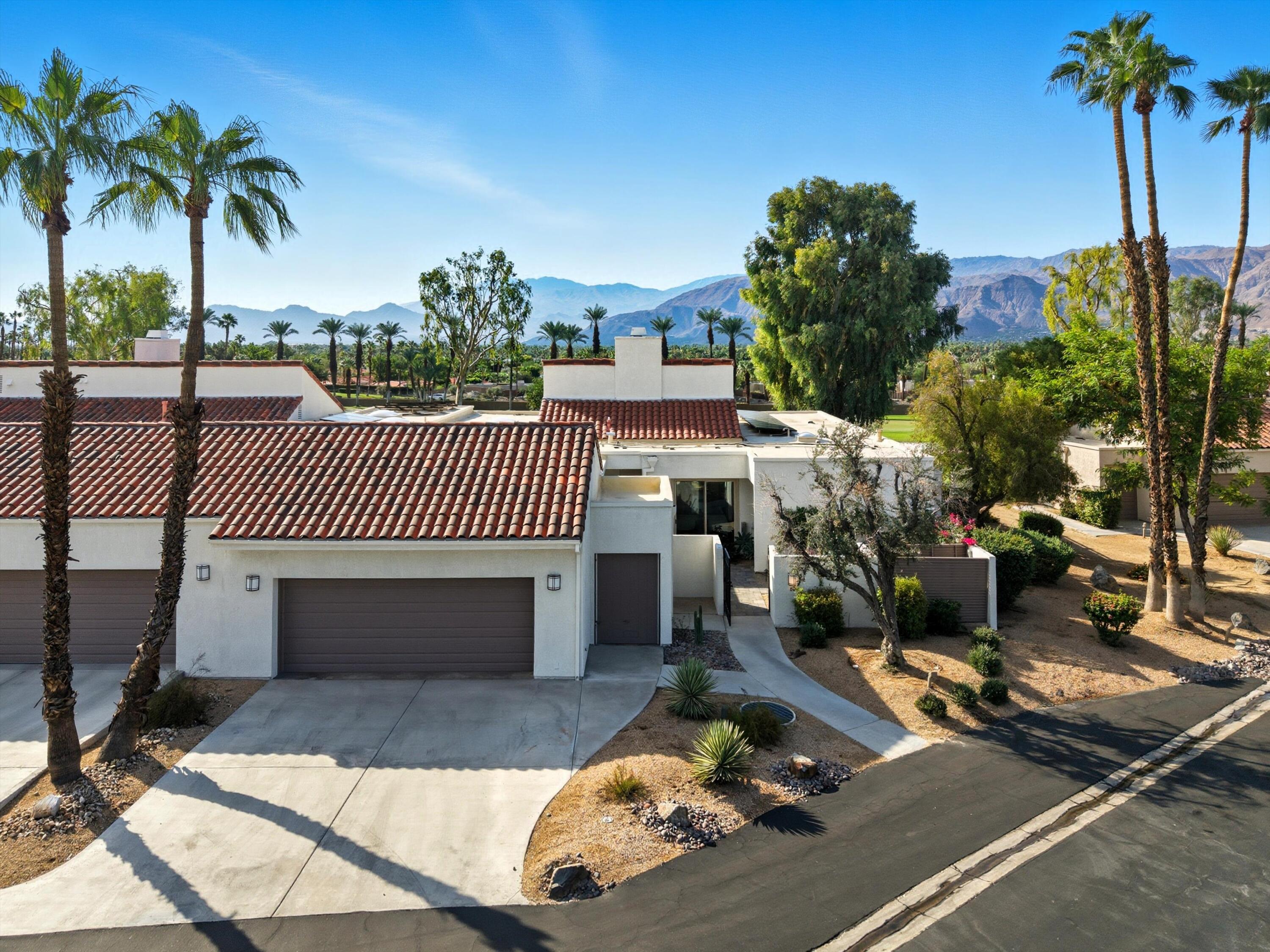 809 Inverness Drive Rancho Mirage, CA 92270 - Photo 2 of 36 a view of a swimming pool with a patio