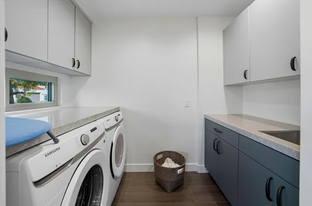 a utility room with dryer and washer